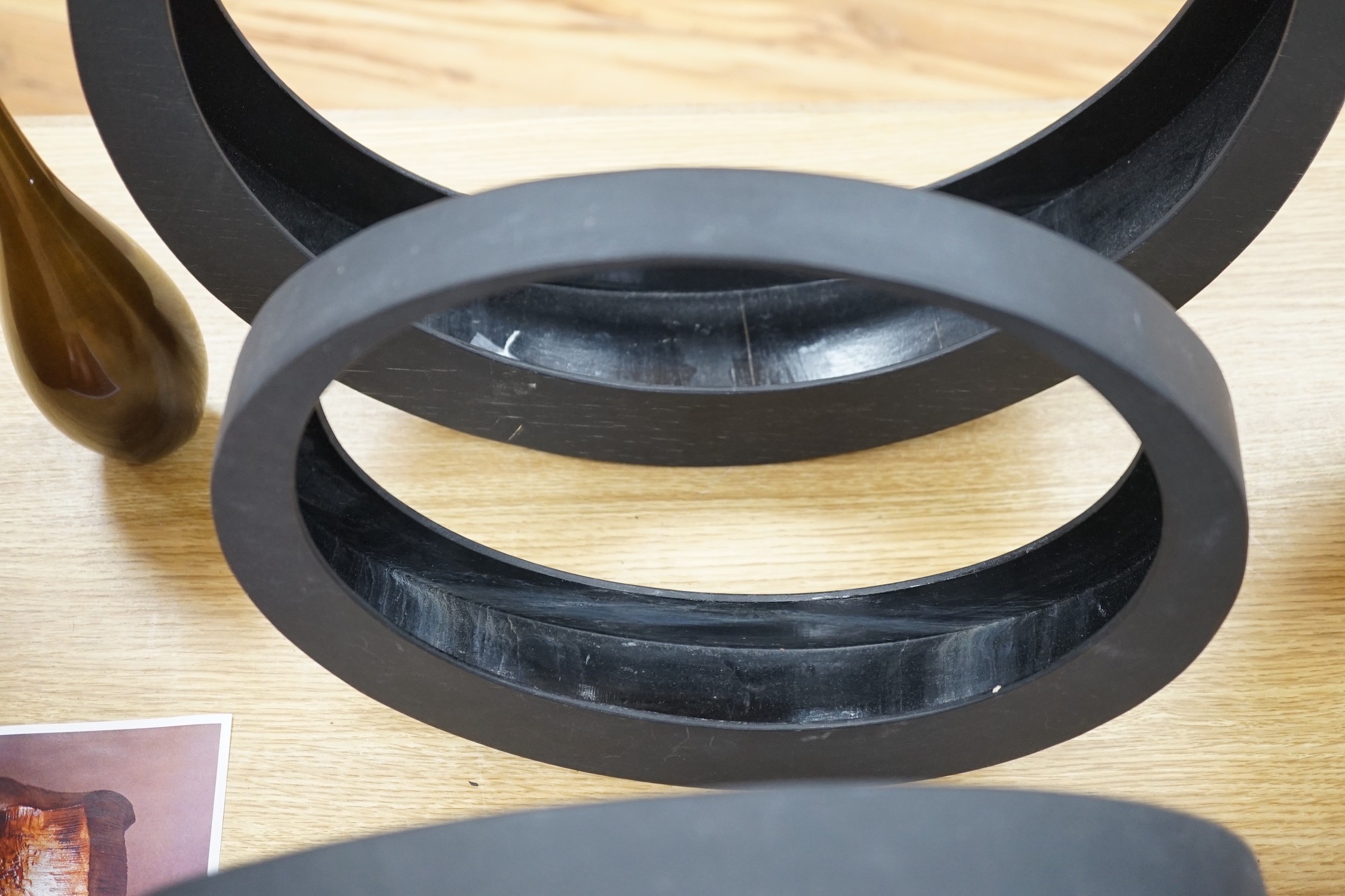 A Japanese bronze bottle vase, 30cm high, three circular black painted wooden abstract sculptures, possibly by Huw Powell Roberts, tallest 42.5cms